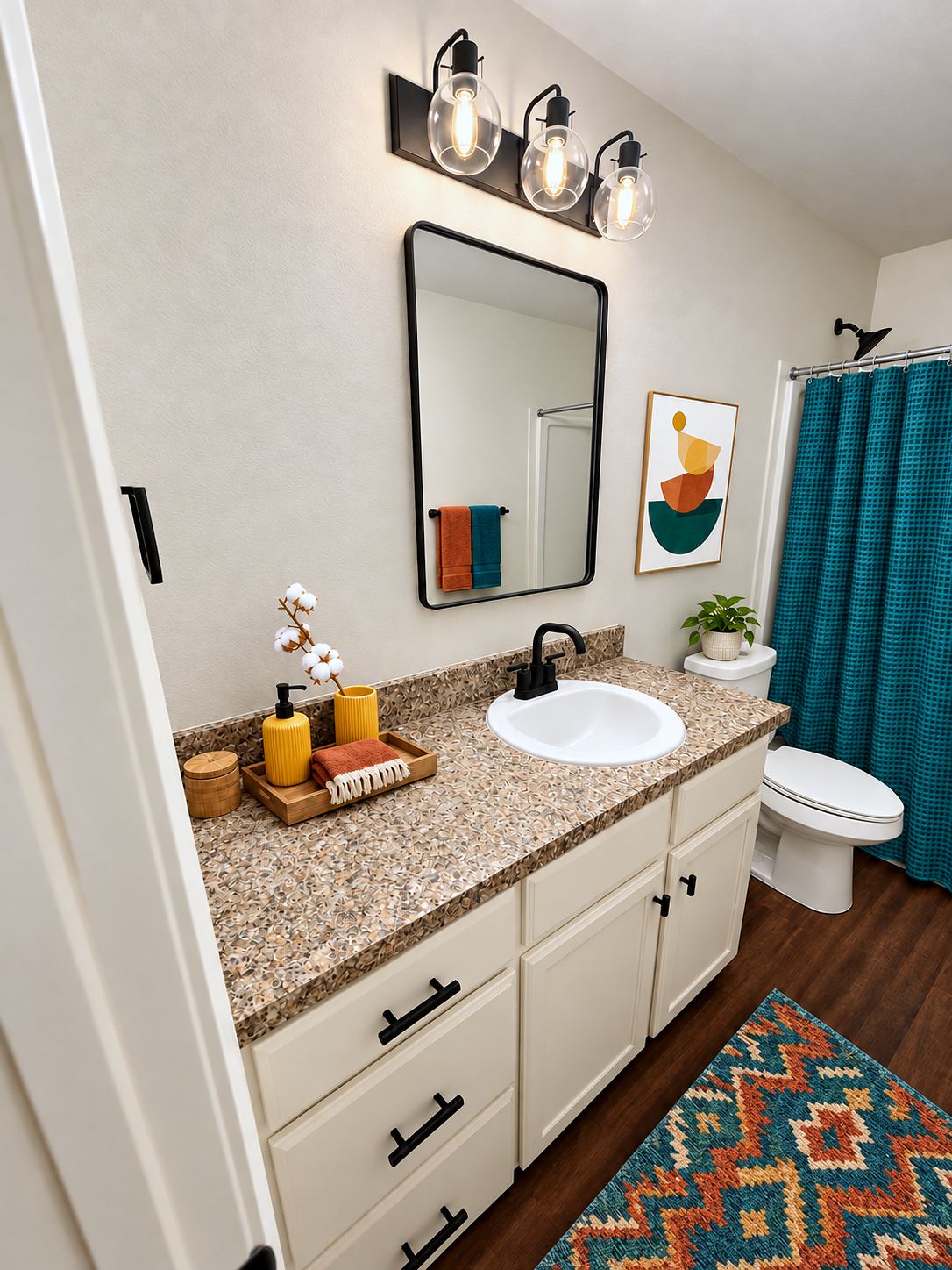 Bathroom with modern black fixtures, framed mirror and tub with shower